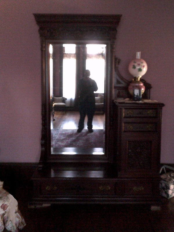 Me taking a selfie at the mirror in Sarah's Room, where ghosts are often seen in photographs at the notoriously haunted Wilson Castle in Proctor, Vermont.