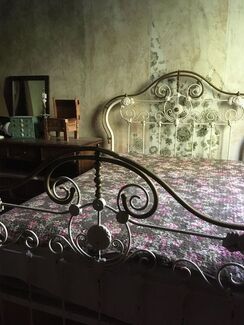 A bed in the servant's quarters of the notoriously haunted Wilson Castle in Proctor, Vermont.